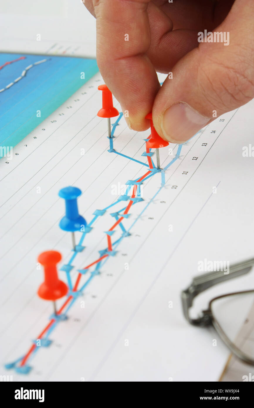 Graphs tables and documents laid on the table Stock Photo