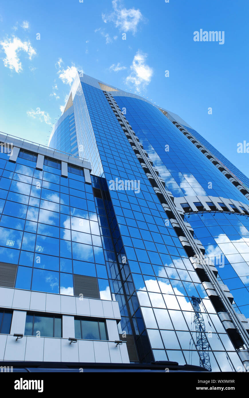Modern office building with sky reflection in windows Stock Photo - Alamy