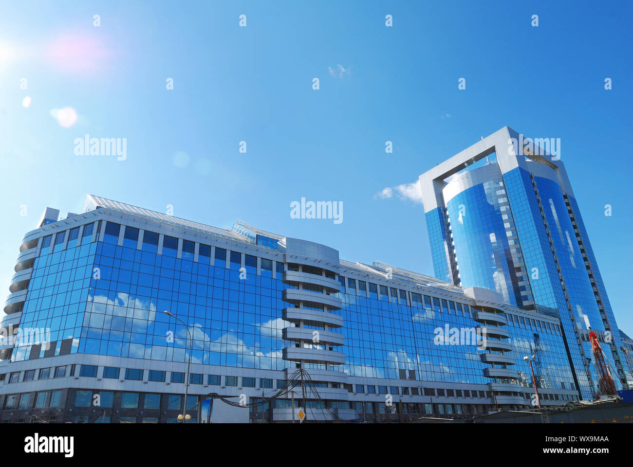 Modern office building with sky reflection in windows Stock Photo - Alamy