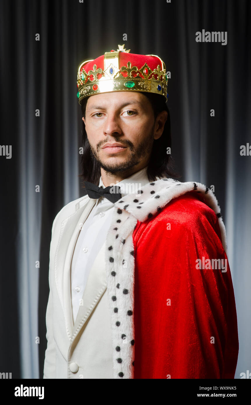 Funny king wearing crown in coronation concept Stock Photo - Alamy