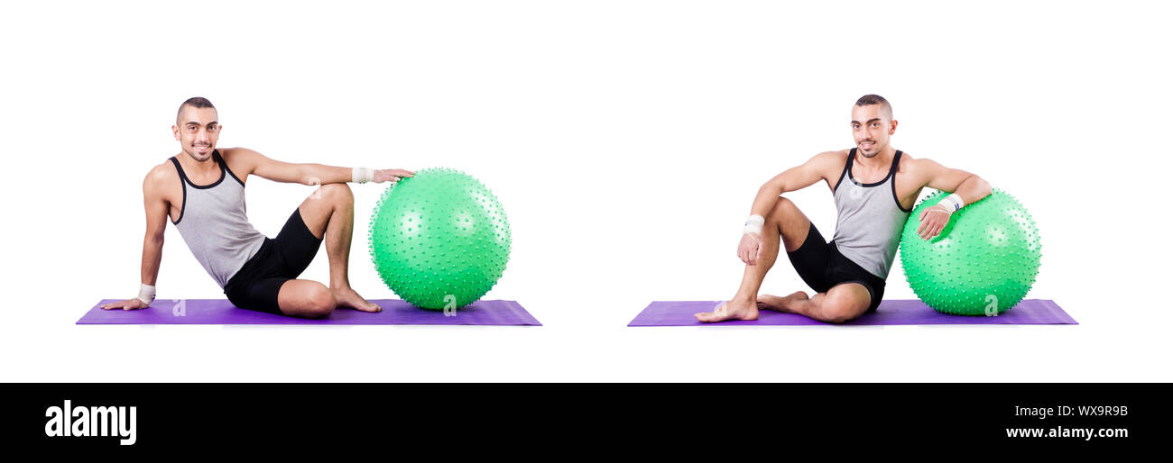 Man with swiss ball doing exercises on white Stock Photo - Alamy