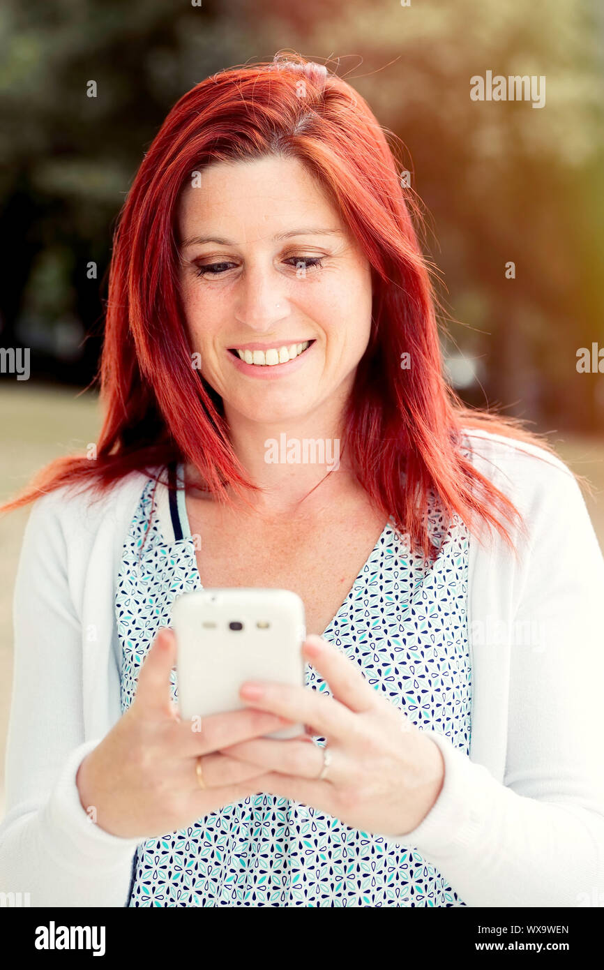 Pretty Smiling Redhead Woman Sending Messages Or Make A Selfie On