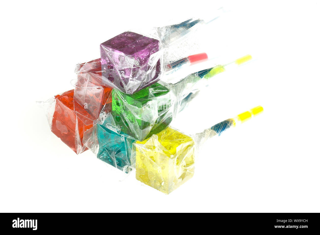 Translucent Lollipops bounch of colorfull translucent dice shaped lollipops backlit on white ...