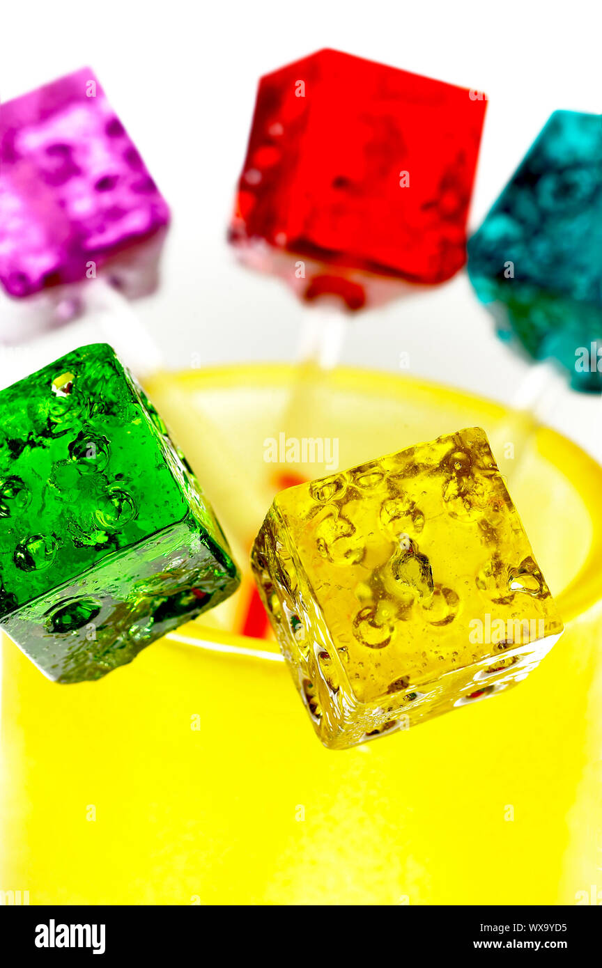 Translucent Lollipops bounch of colorfull translucent dice shaped lollipops backlit on white ...