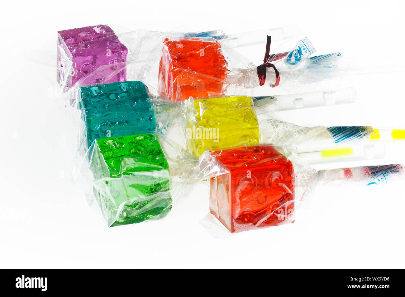 Translucent Lollipops bounch of colorfull translucent dice shaped lollipops backlit on white ...