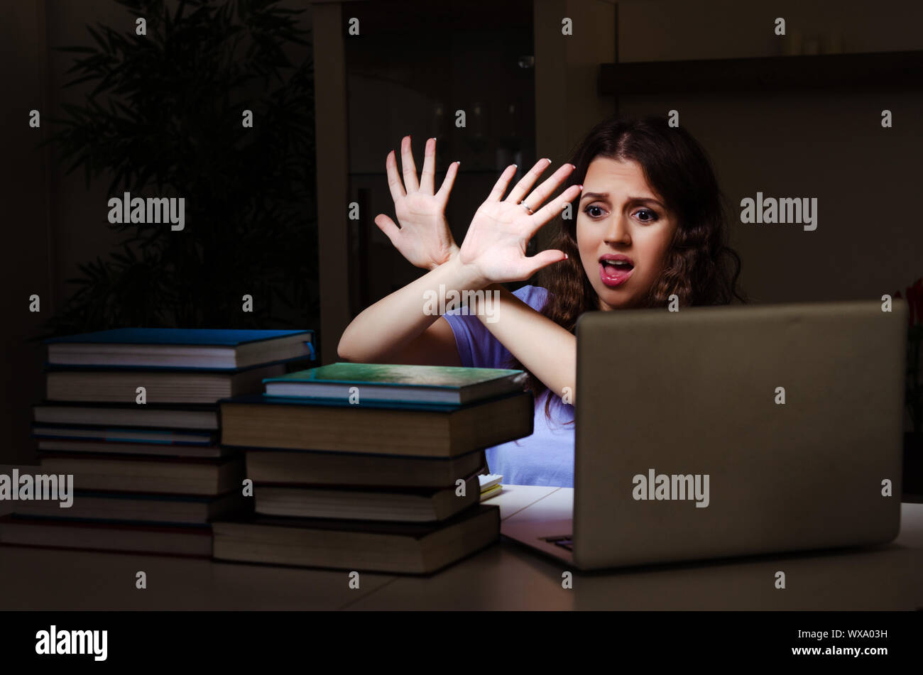 Young female student preparing for exams late at home Stock Photo - Alamy