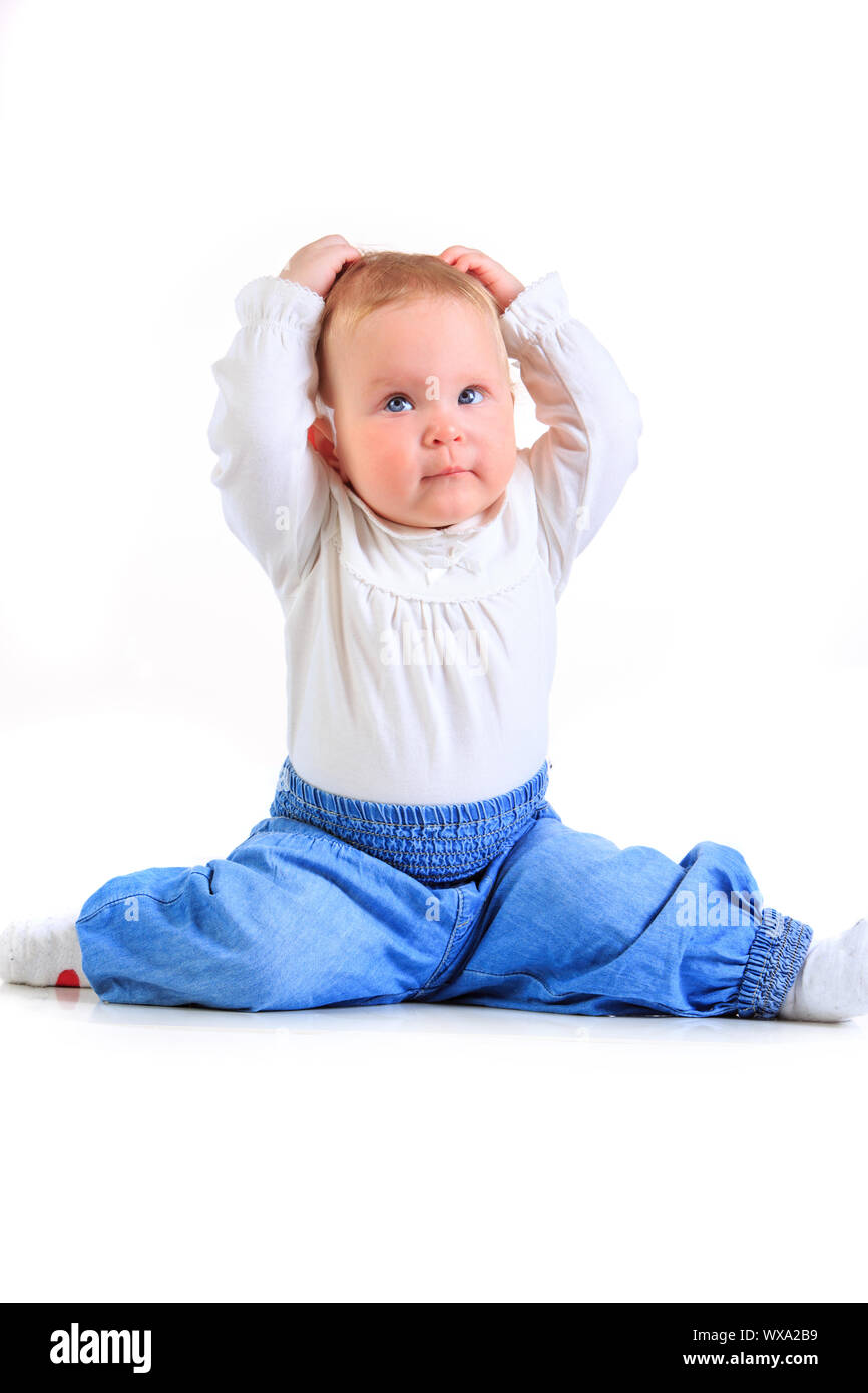 one years old baby girl on a white background Stock Photo - Alamy