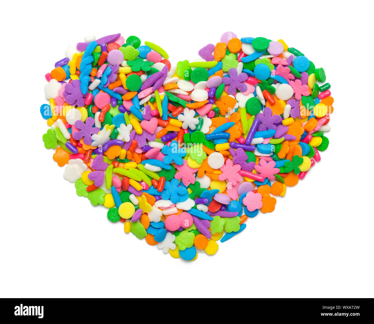 Candy Sprinkles in Heart Shape Isolated on White. Stock Photo