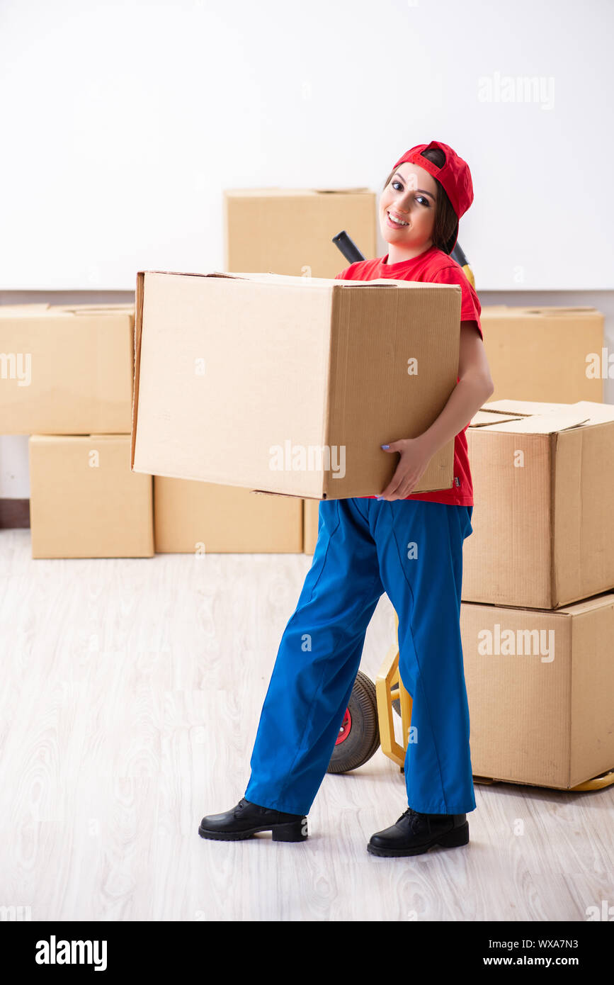 Young female professional mover doing home relocation Stock Photo