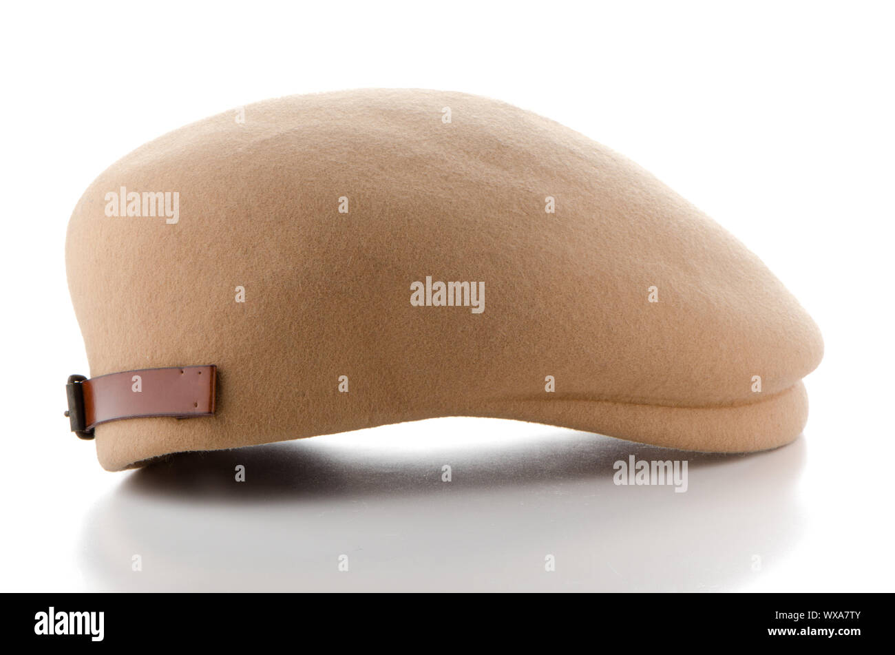 Brown retro style felt cap on white background. Stock Photo