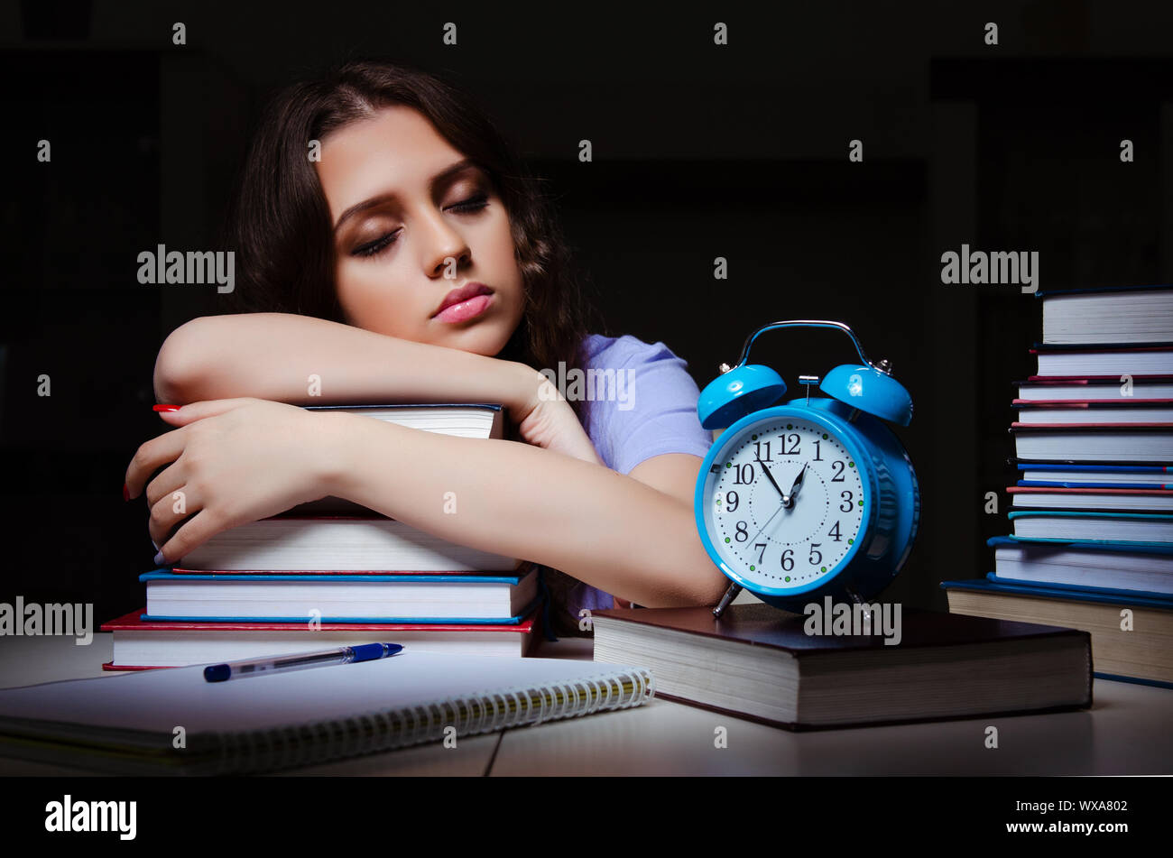 Young female student preparing for exams late at home Stock Photo - Alamy
