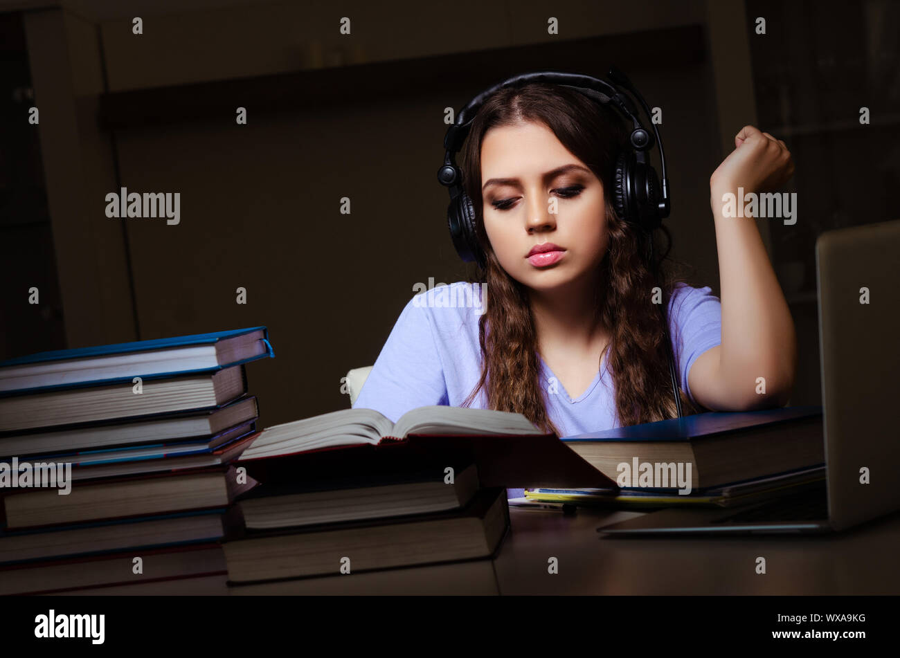 Young female student preparing for exams late at home Stock Photo - Alamy