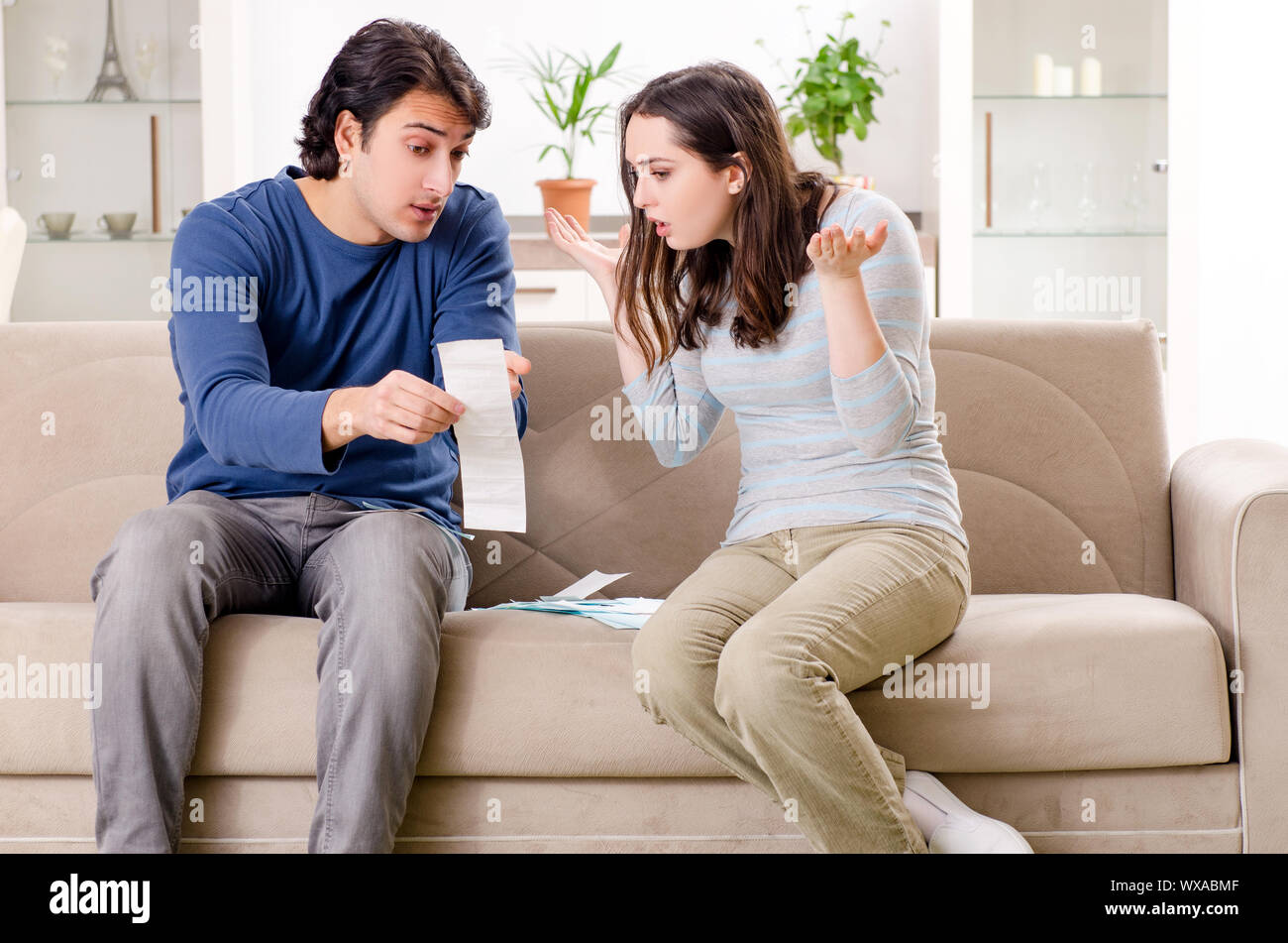 Young couple in budget planning concept Stock Photo - Alamy
