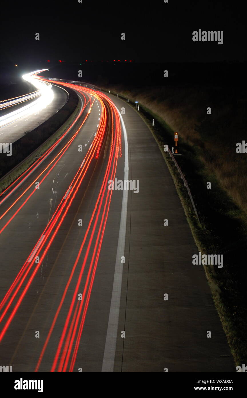 highway at night with car traffic and lights Stock Photo