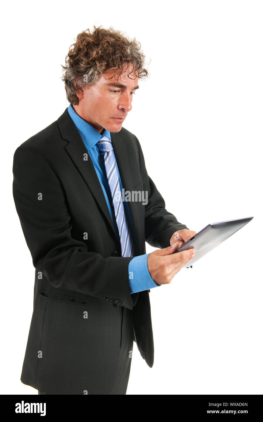 Business man with digital tablet standing in the studio isolated over white background Stock Photo