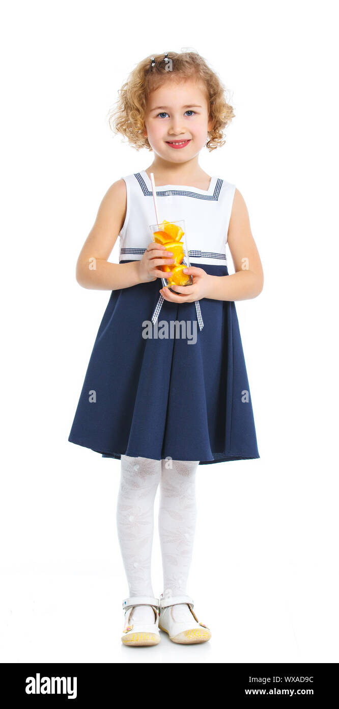 Happy little girl drinking orange juice. Isolated over white background ...