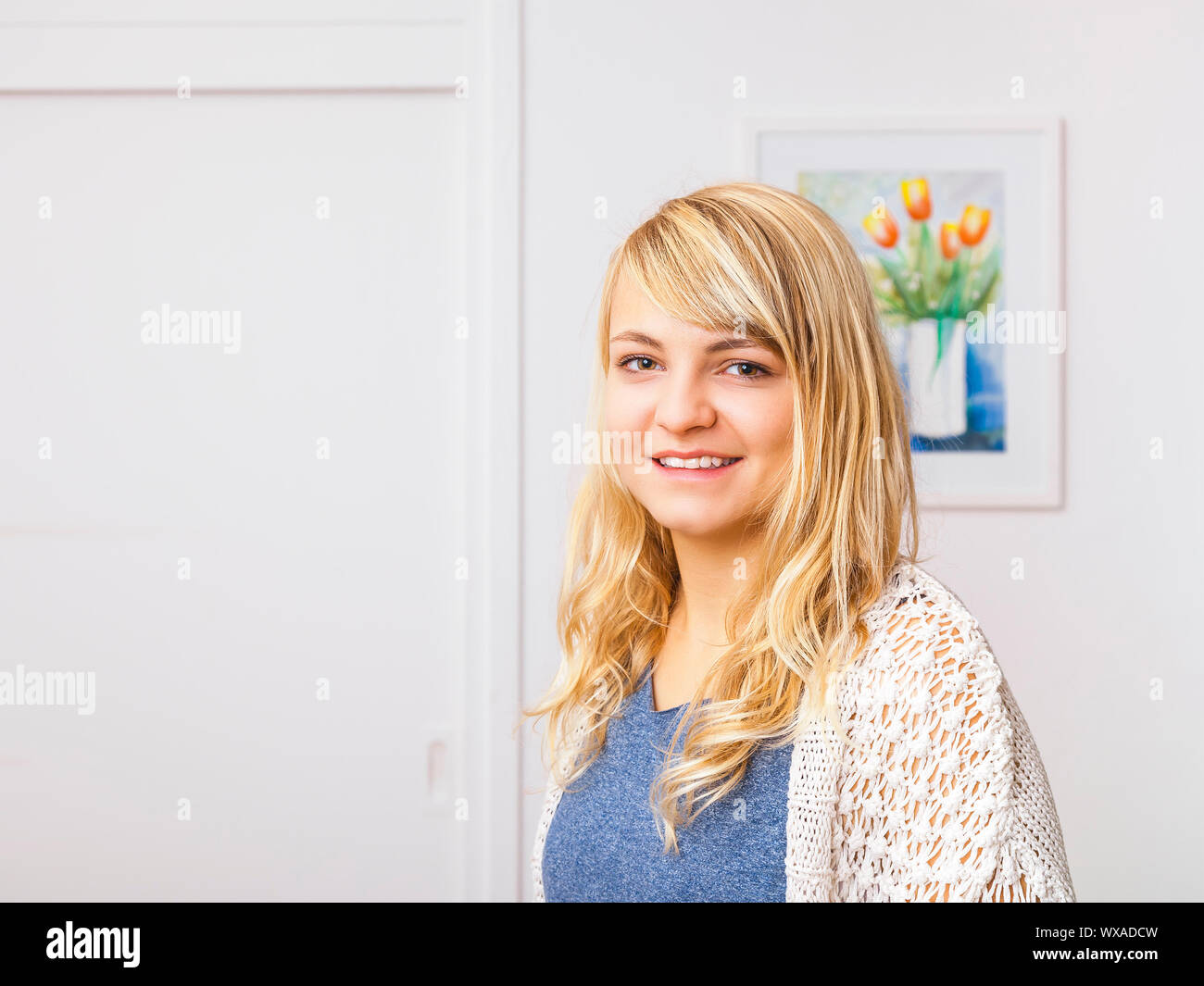 An image of a beautiful smiling blond girl Stock Photo - Alamy