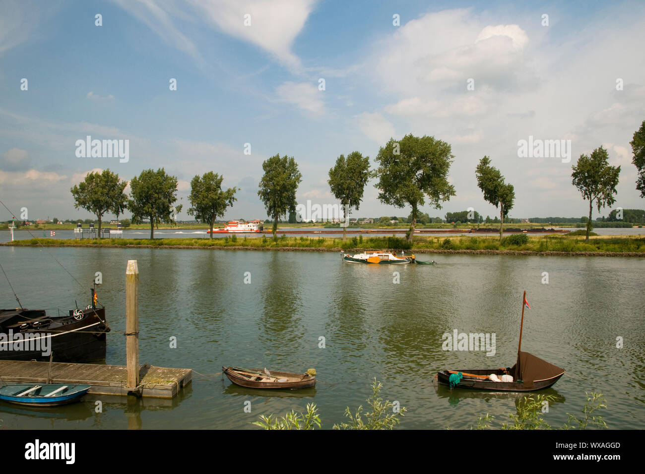 Riverlandscape in Holland with boats Stock Photo