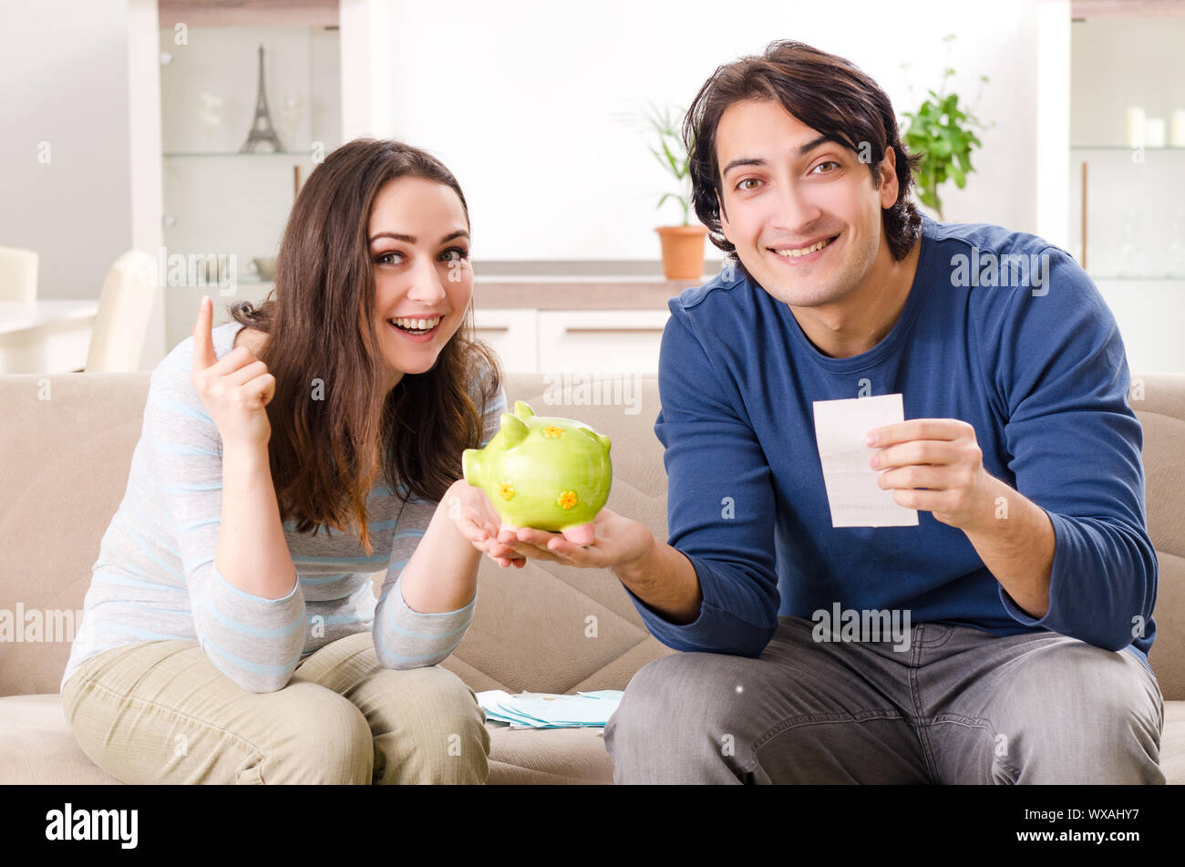 Young couple in budget planning concept Stock Photo - Alamy