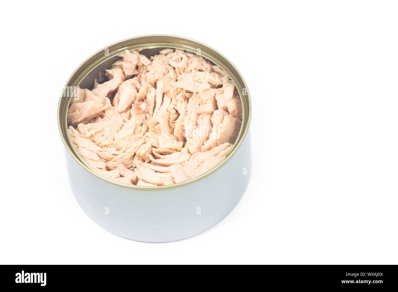 Tuna in vegetable oil in opened can on white isolated Stock Photo Alamy