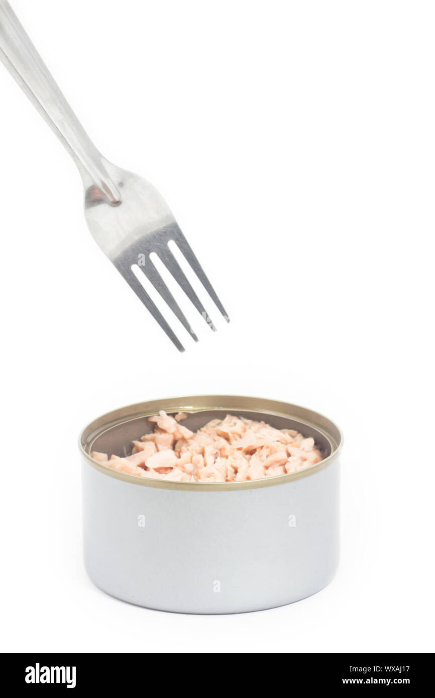 Tuna in vegetable oil with fork on white Stock Photo Alamy