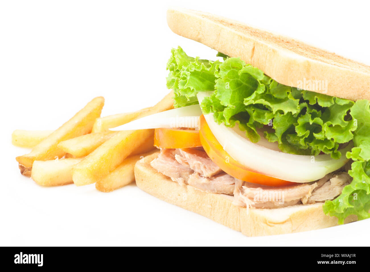 Tuna sandwich with french fries on white isolated Stock Photo Alamy