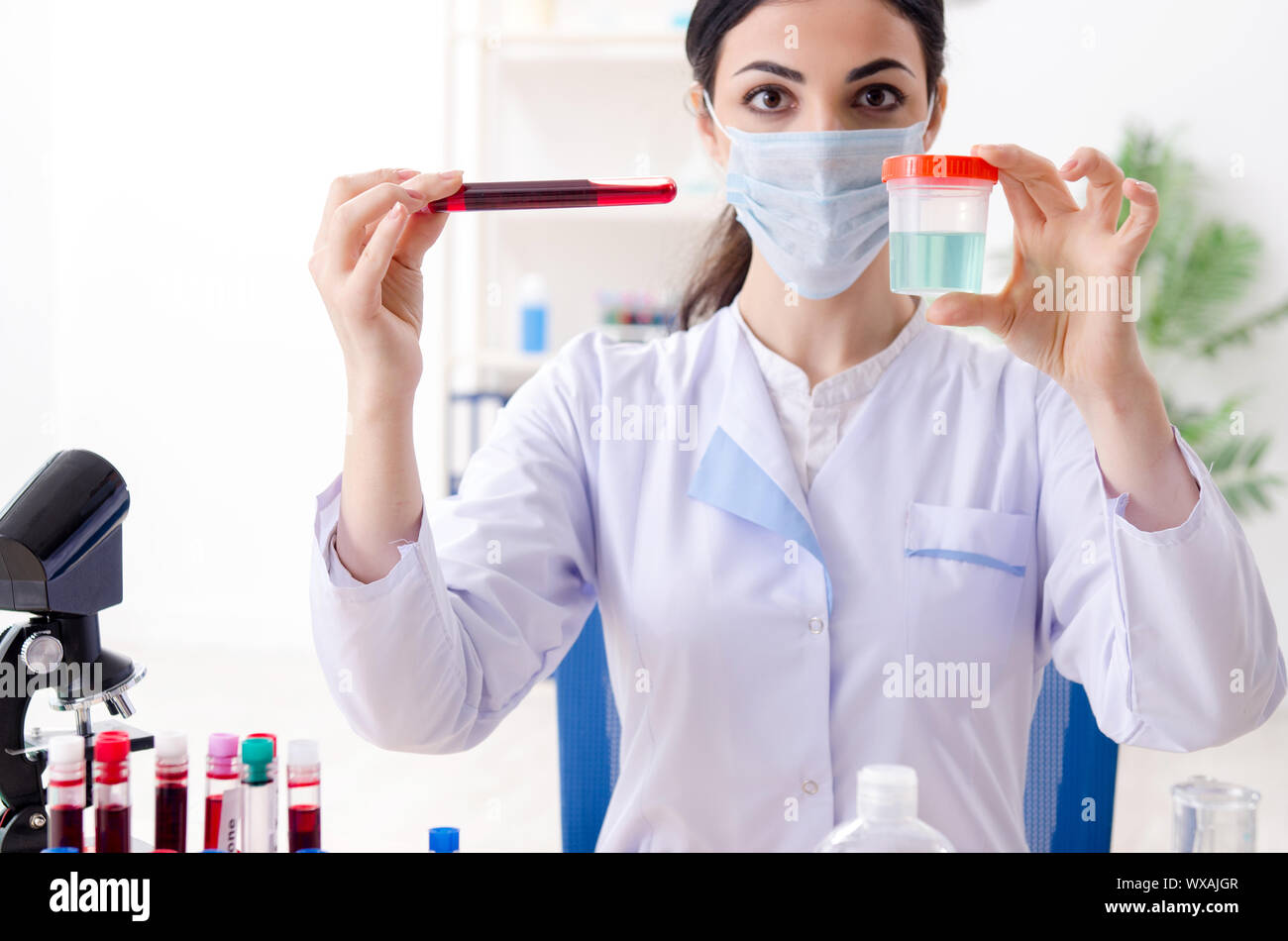 Young female chemist working in the lab Stock Photo