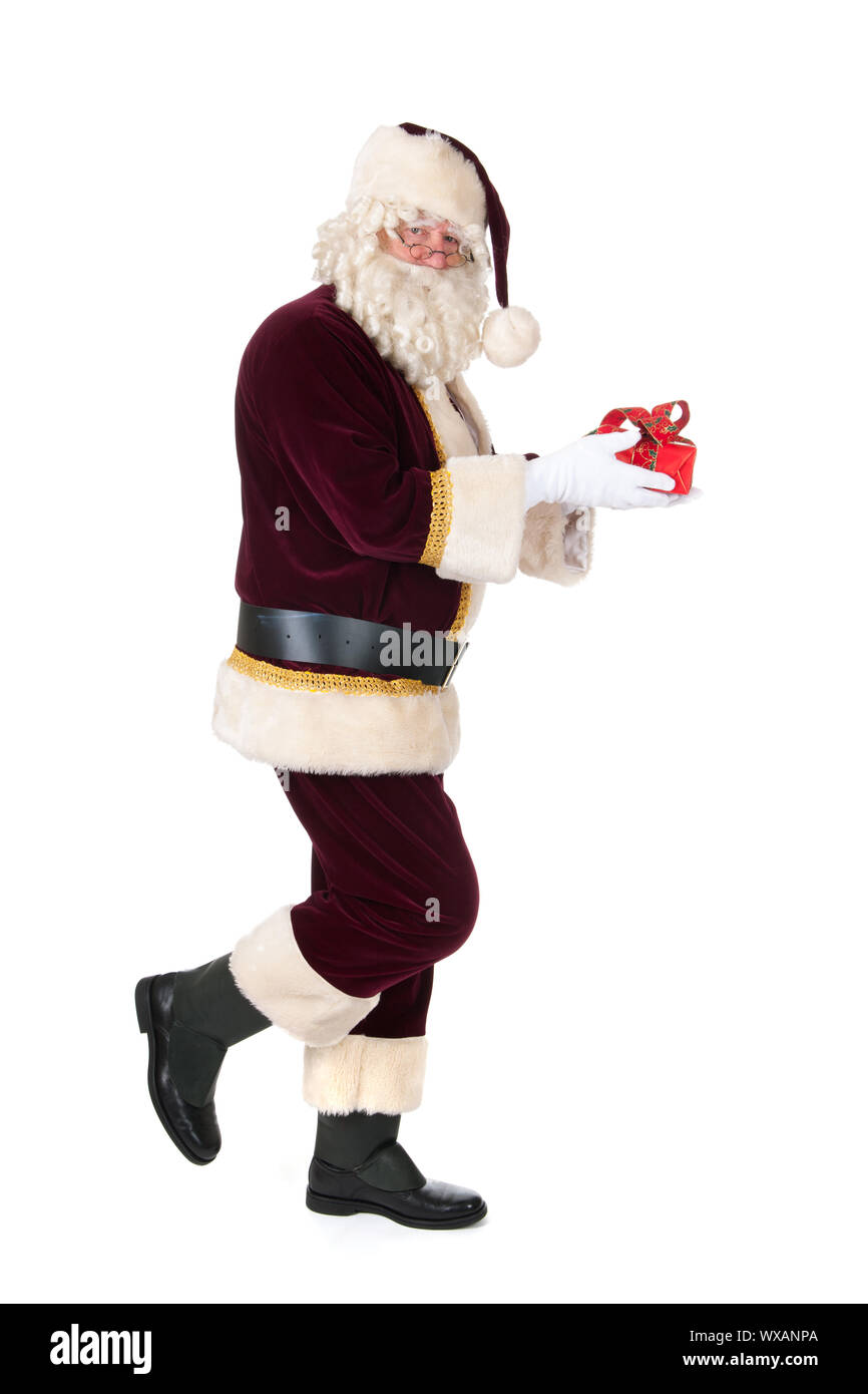 The real Santa Claus is walking by with luxury present Stock Photo