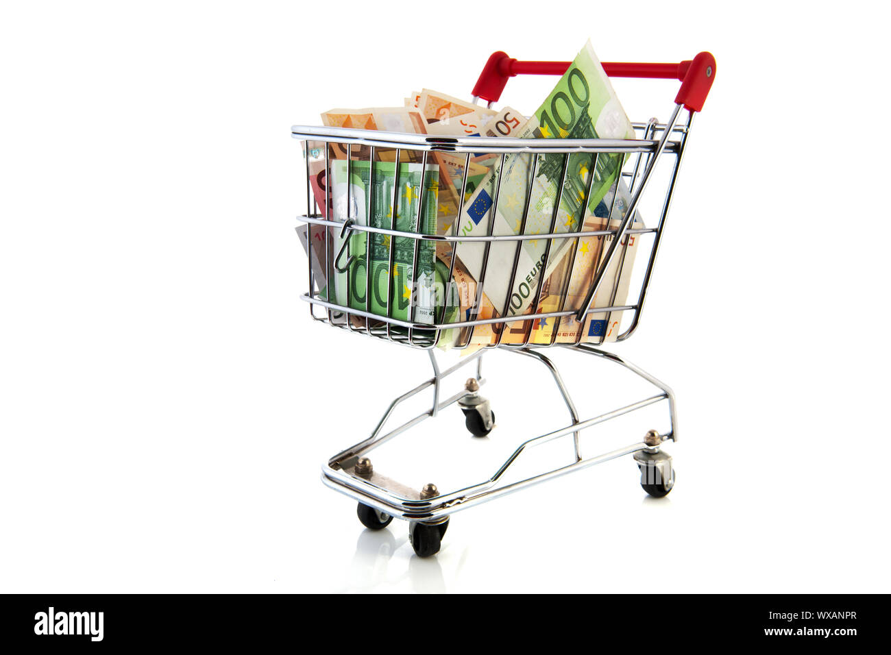 Expensive shopping cart with euro banknotes in different values
