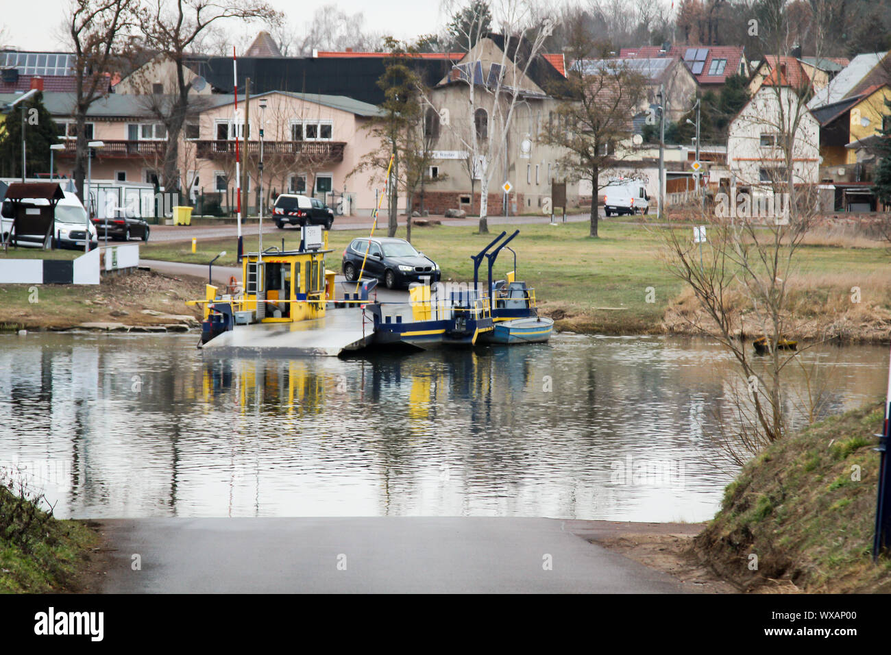 A river ferry across the Saale is waiting for cars Stock Photo