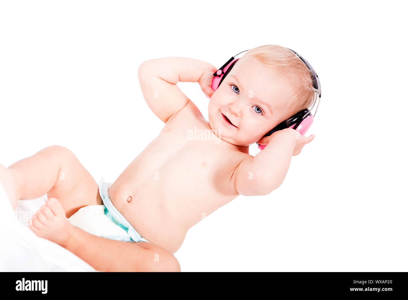 cute little baby with protection earphones isolated on white Stock Photo
