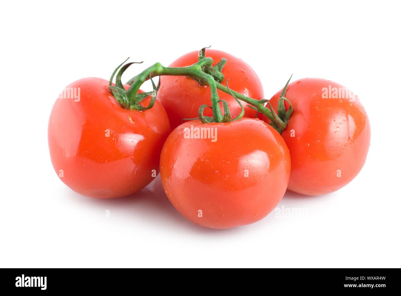 Four ripe tomatoes isolated on white background Stock Photo - Alamy