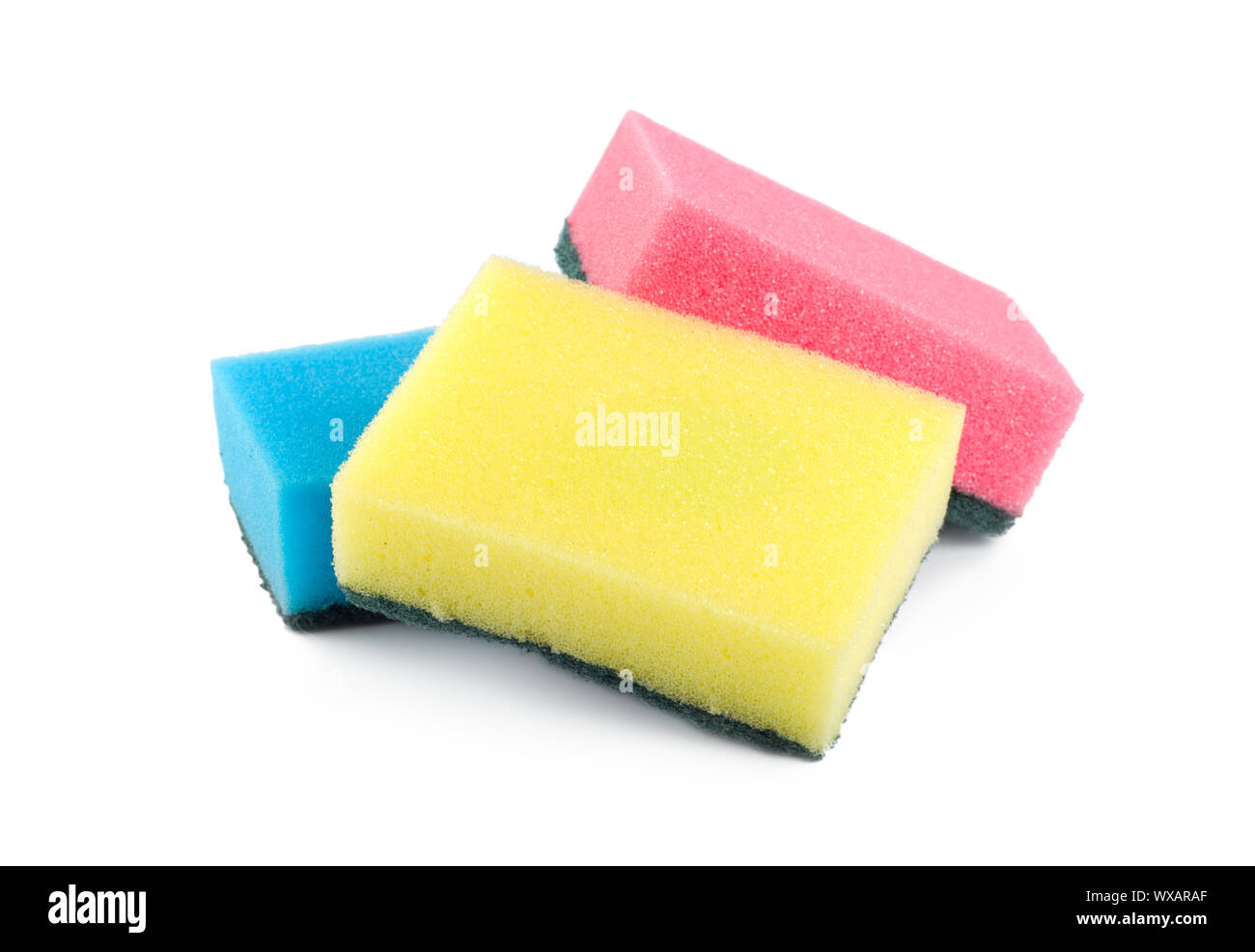 Three colored sponges isolated on white background Stock Photo - Alamy