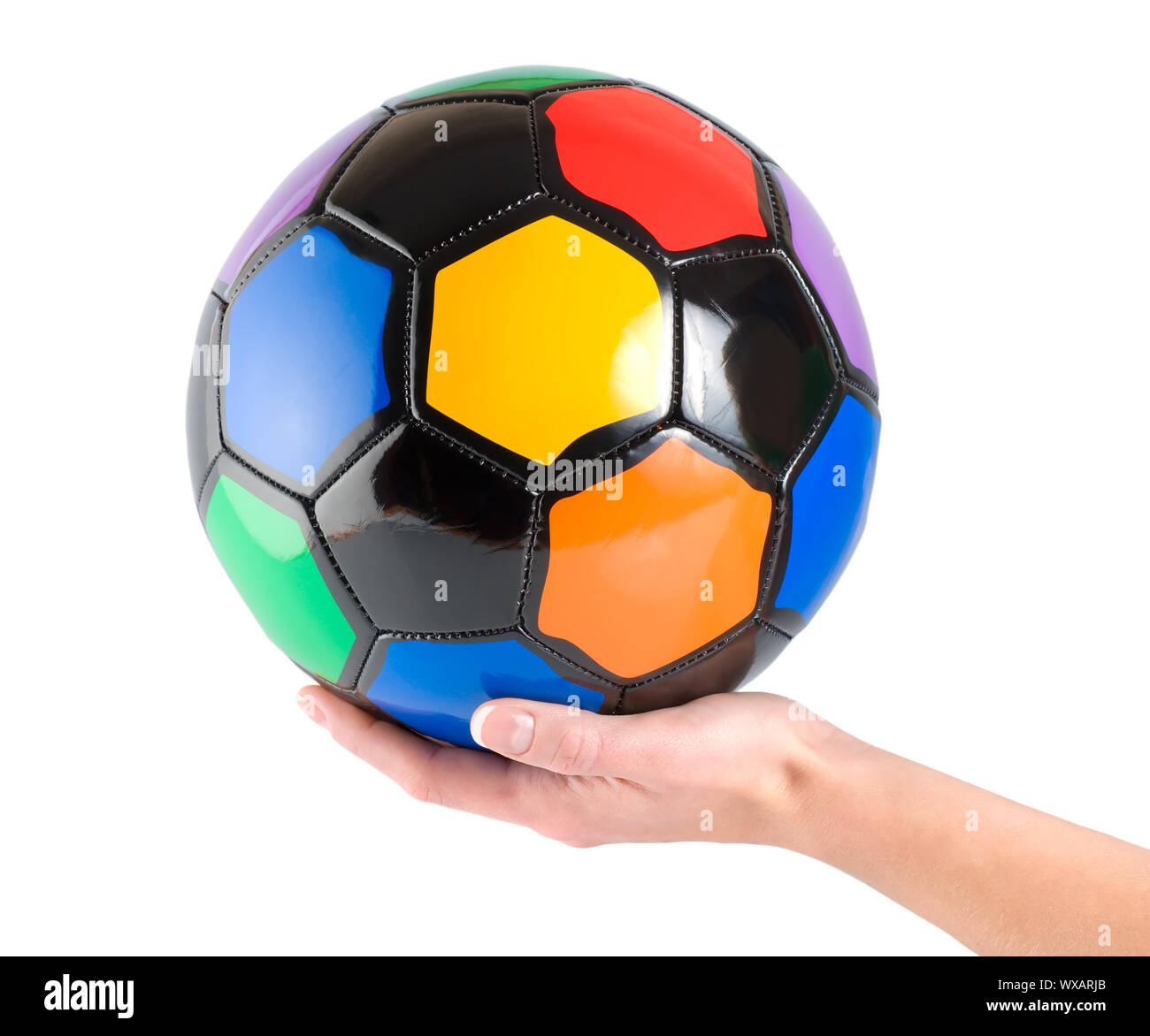 Soccer ball in hand isolated on white background Stock Photo Alamy
