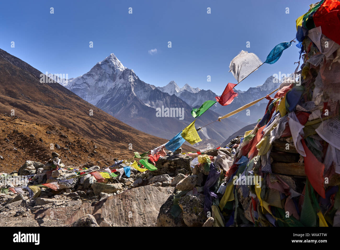 Prayer flags and mountain Ama Dabalam in Nepal Stock Photo