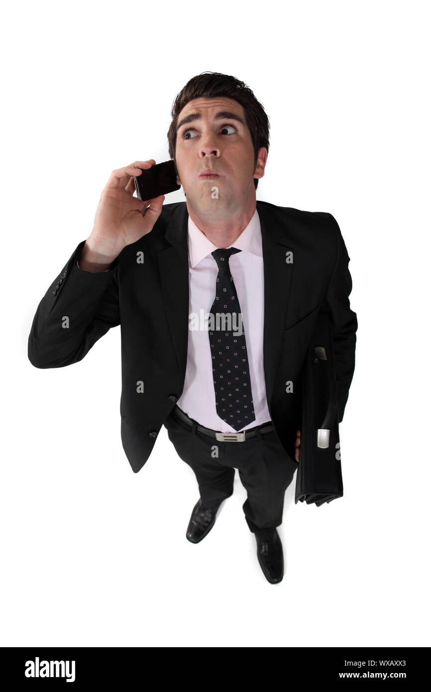 Man blowing with mobile phone Stock Photo Alamy