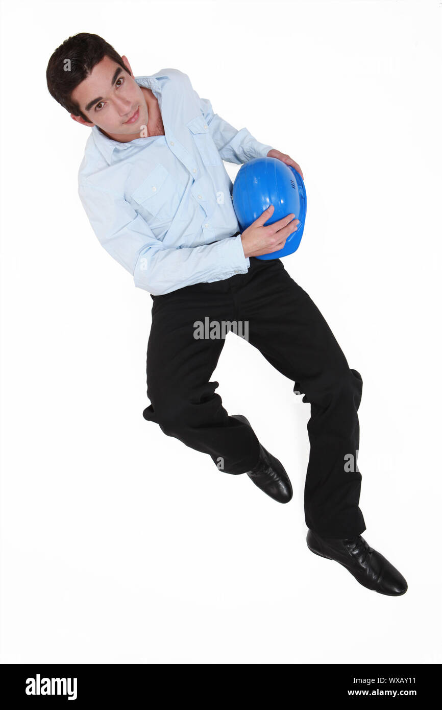 Young architect laying on the floor Stock Photo