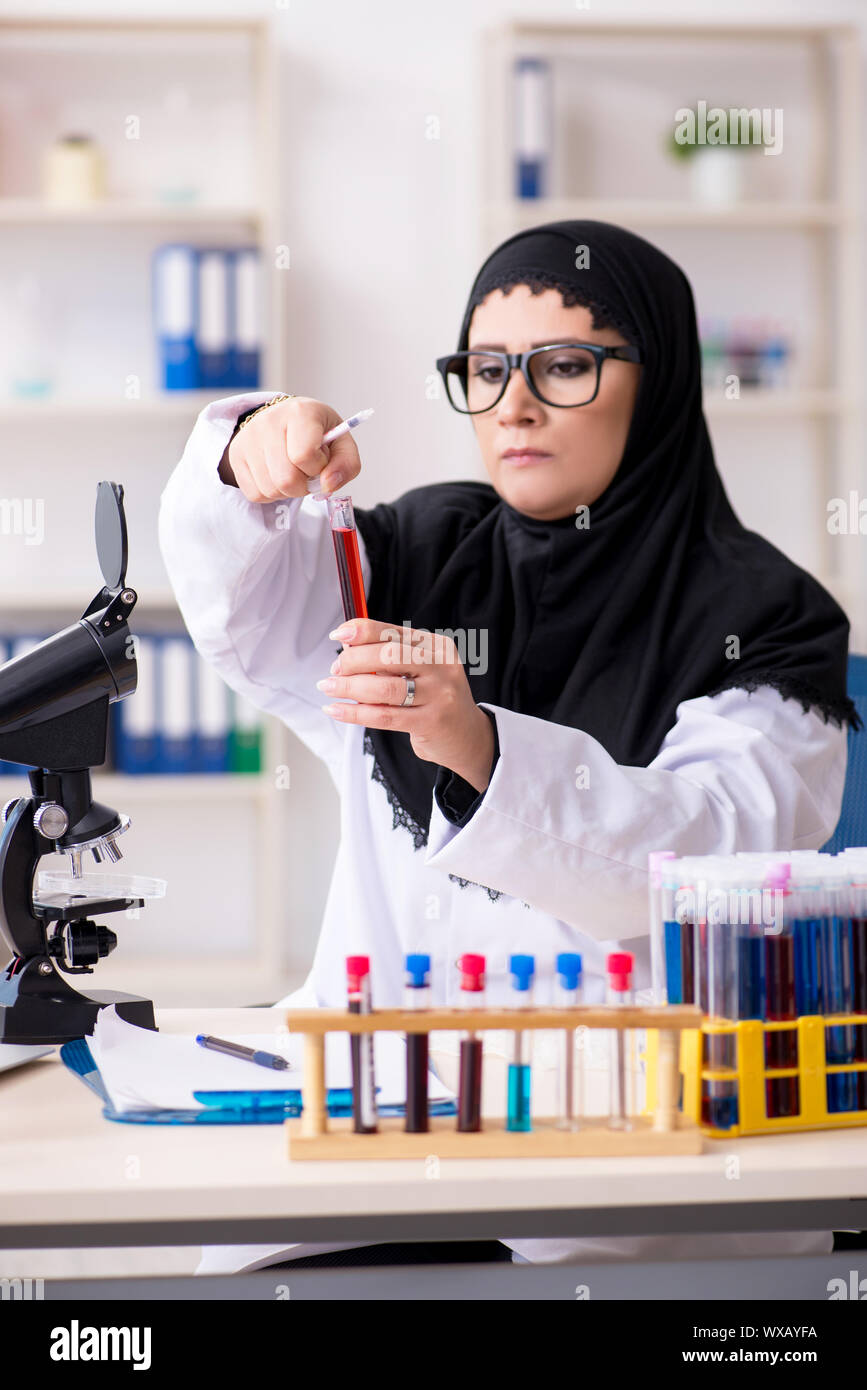 Female chemist in hijab working in the lab Stock Photo - Alamy