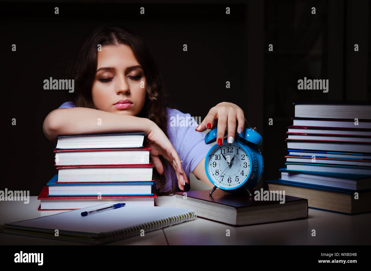 Young female student preparing for exams late at home Stock Photo - Alamy