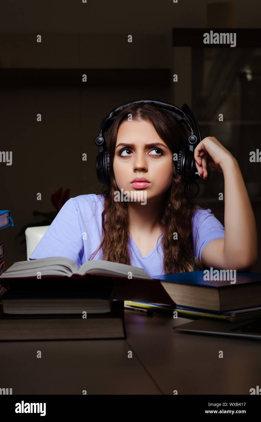 Young female student preparing for exams late at home Stock Photo - Alamy