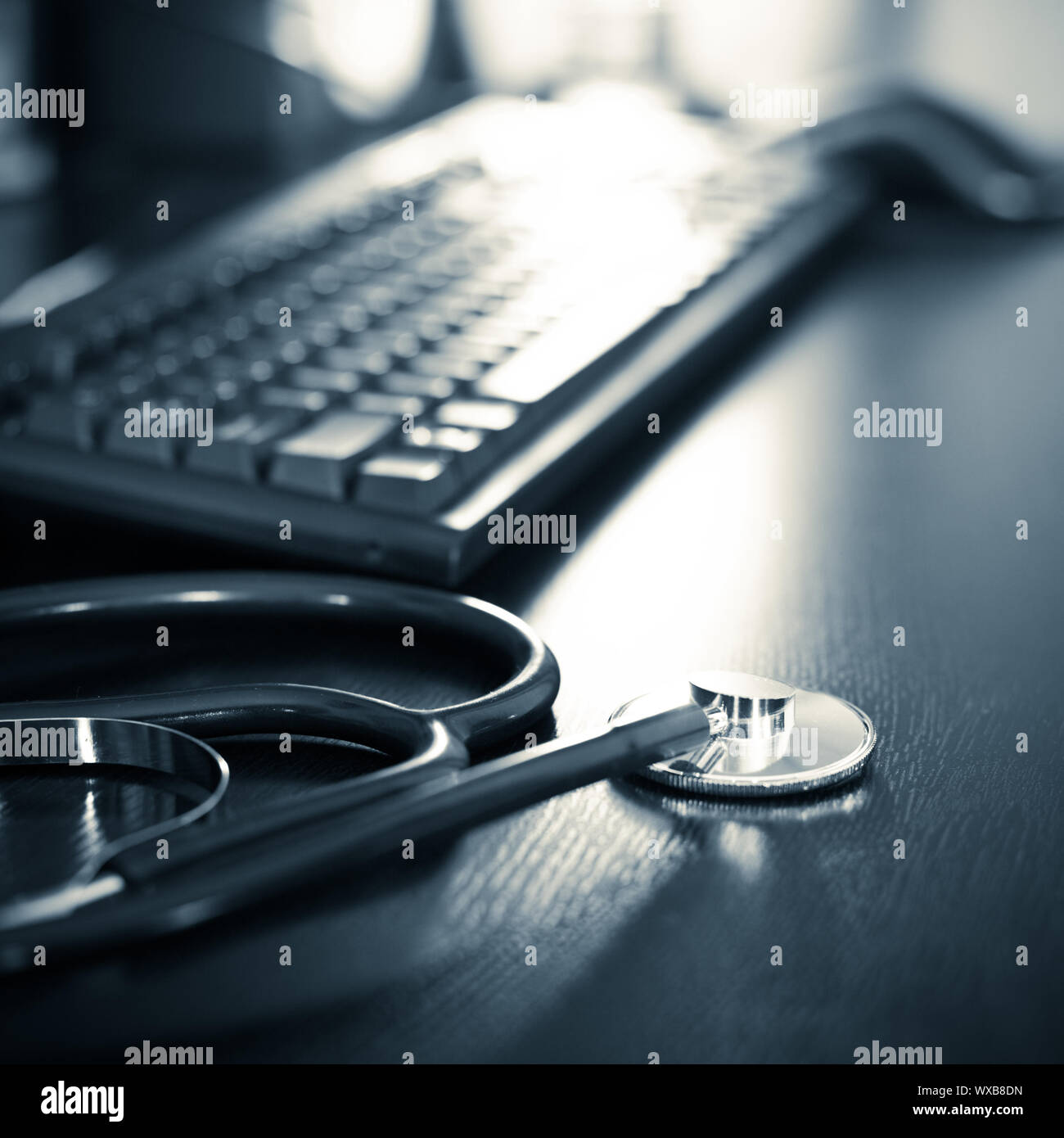 Stethoscope on a table with keyboard, very shallow DOF Stock Photo - Alamy