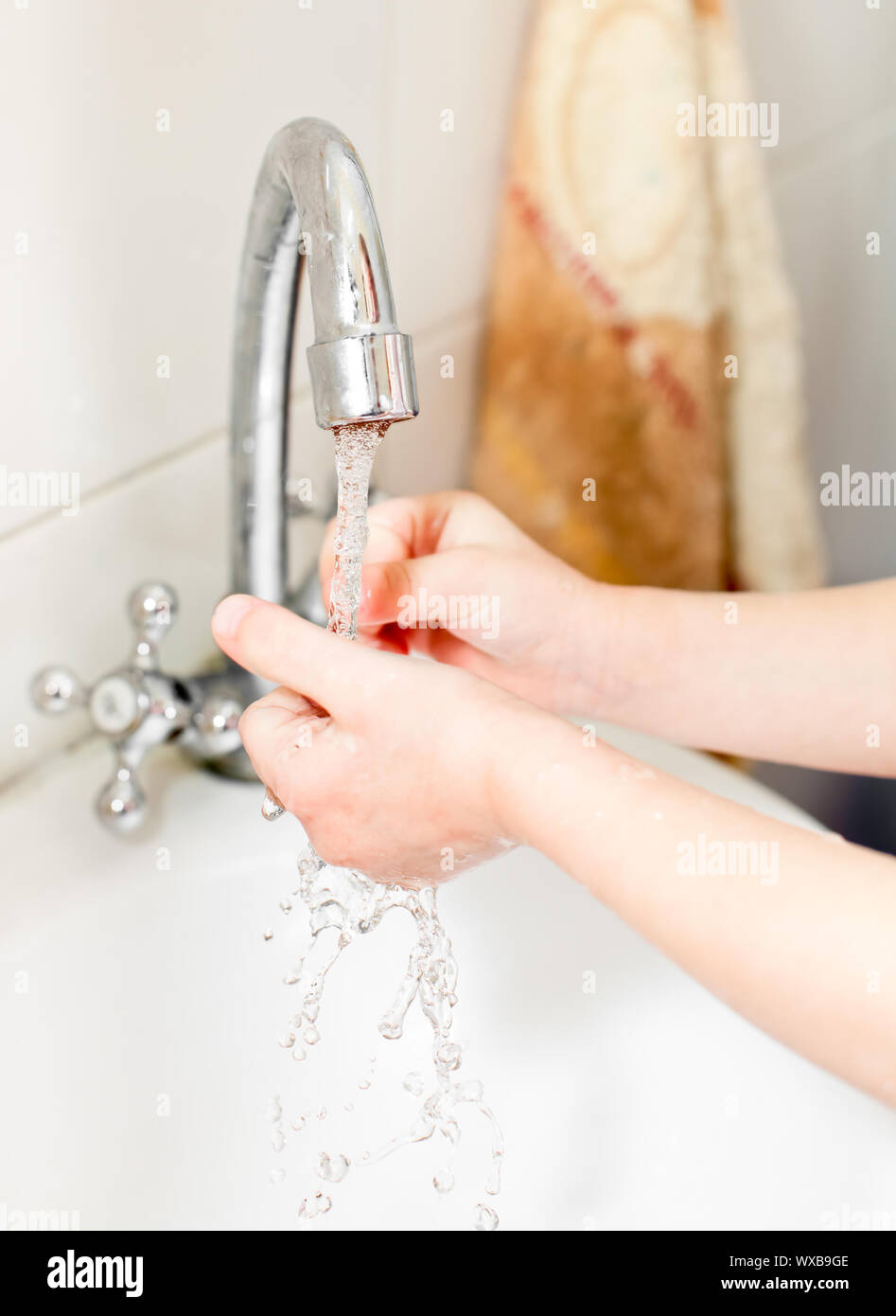 Little girl washing her hands in bathroom, shallow focus Stock Photo ...