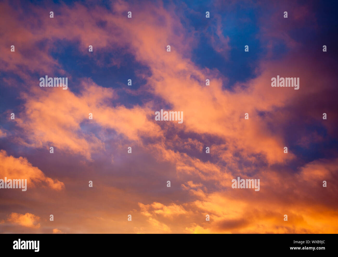 Dramatic sky with orange clouds at sunset Stock Photo - Alamy