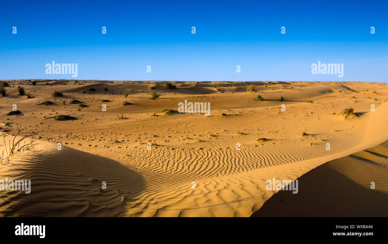 Desert landscape with blue sky Stock Photo - Alamy