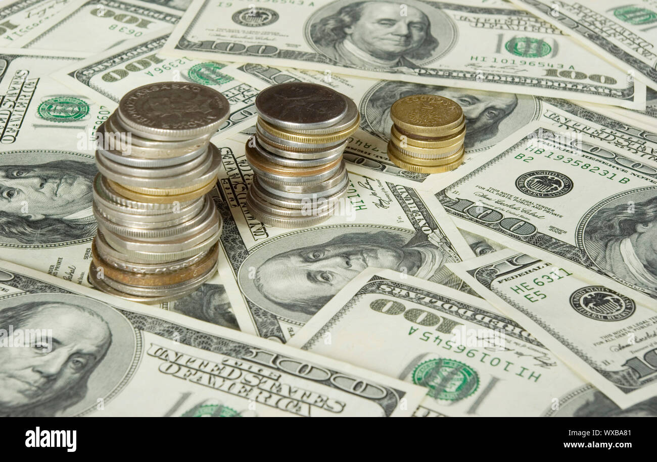 coins isolated on dollars background Stock Photo - Alamy