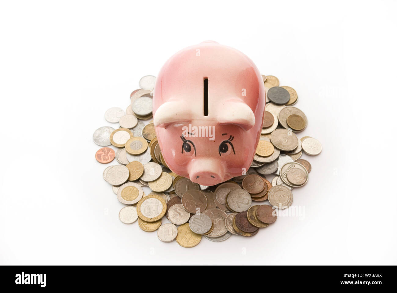 Pink piggy bank isolated on white background with coins Stock Photo - Alamy