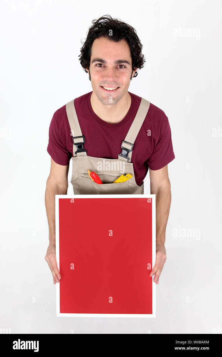 Carpenter with a blank board Stock Photo - Alamy
