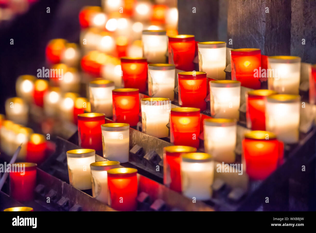 Burning candles in catholic church Stock Photo Alamy