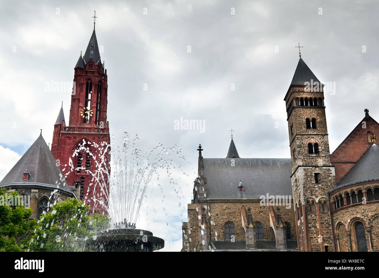 fountain on Vrijthof square and Saint Servatius Basilica in Maastricht, Netherlands Stock Photo