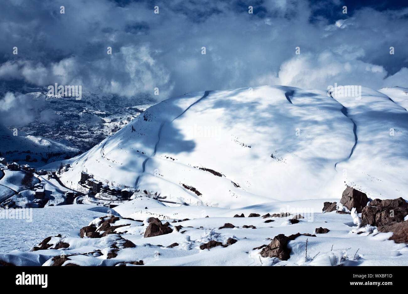 Image of Faraya mountains covered snow, small country houses located on snowy hill, luxury ski resort, seasonal travel, january frosty weather, snowin Stock Photo